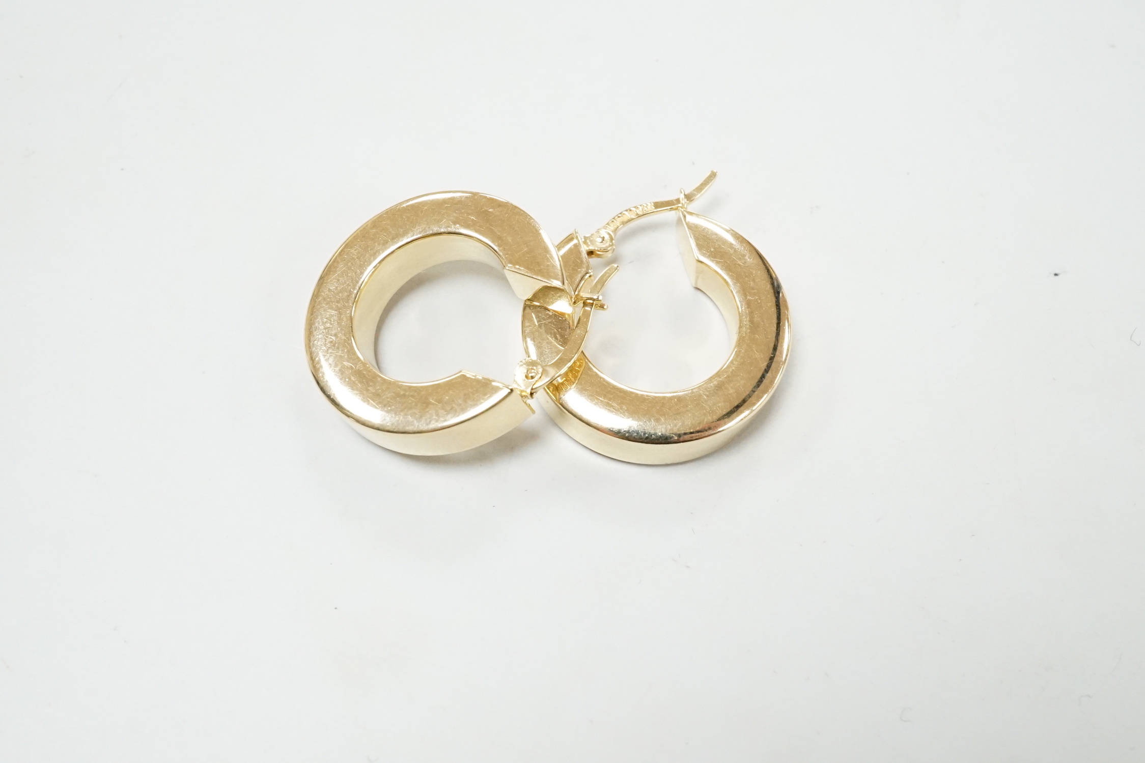 A pair of modern 14k yellow metal hoop earrings, 20mm, 5.8 grams.